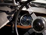 steering wheel and dashboard of a car with a clock on the dash