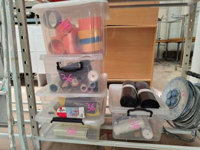 a shelf with a lot of craft supplies on it