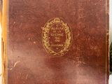 an old book that is sitting on a table