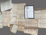 a pile of old papers and papers on a table