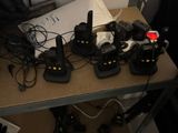 a table with a bunch of radio ' s on top of it