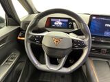 the interior of a car with a steering wheel, dashboard, and monitor