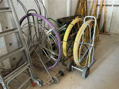 a lot of different types of hoses and wheels in a room