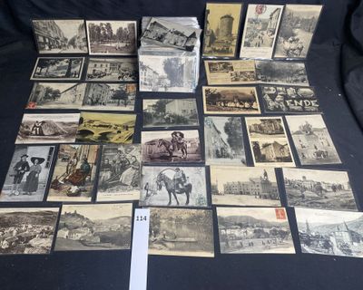 many old postcards of different types and sizes are on a table