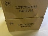 two boxes of lotosim parfum sitting on a table