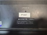 a black laptop with a label on the back of it