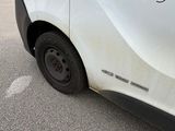 a white van with a red and black logo on the side