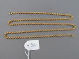 a gold chain with a tag attached to it
