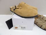 pair of men ' s sued clogs in box on white surface