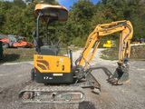 an image of a small excavator parked in a lot