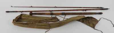 two fishing rods and a bag on a white surface