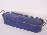 a blue metal container with handles on a white surface