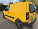 the yellow van is parked in the parking lot with its door open