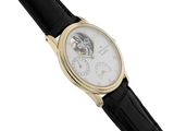a close up of a watch on a white background with a black strap