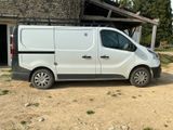 a white van that is parked in front of a building