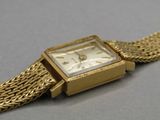 an image of a close up of a wrist watch on a table