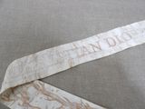 a neck tie with a design on it laying on a table