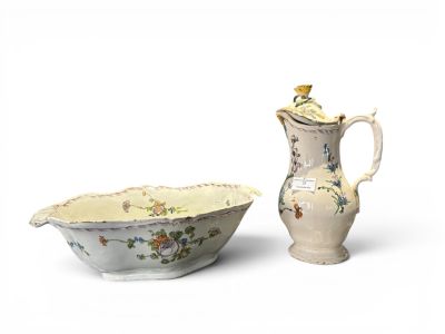 two pieces of porcelain are sitting next to each other on a white surface