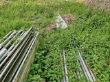 an image of a bunch of pipes that are in the grass
