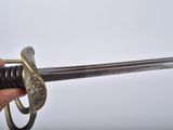 a person holding a sword in their hand on a white background