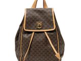 a brown and tan backpack with a brown handle