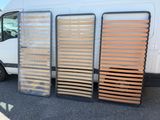 three wooden slats on the side of a white van