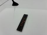 a ruler that is sitting on the floor next to a lamp