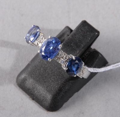 an image of a ring with three sapphires on it