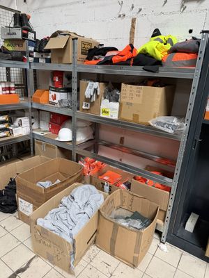many boxes and boxes on the floor in a room