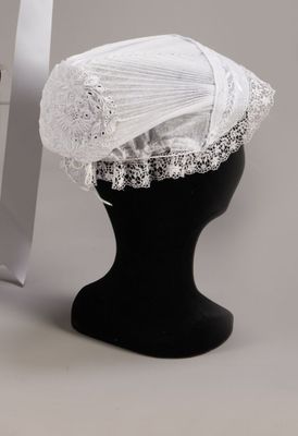 a white hat on a black mannequin head