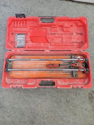 the tools are in the red case on the concrete floor