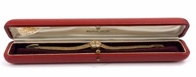 a red case that has a watch inside of it