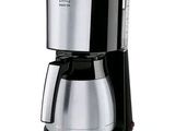 the coffee maker is on a white background with a black handle