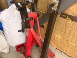 a picture of a red jack stands in front of a cardboard box