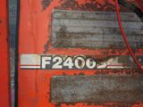 a close up of a red tractor door with a number on it