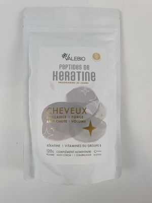 a close up of a bag of herbs on a white surface