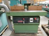 a machine that is sitting on a pallet in a warehouse