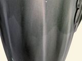 a vase that is sitting on a stand on a table