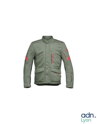 a close up of a green jacket with red logos on it