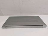 a laptop that is sitting on a white surface