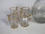 five cups and a jug on the table