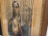 painting of a woman holding a baby in a gold frame