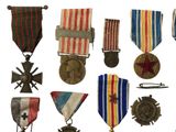 many medals and medals on display on a white background