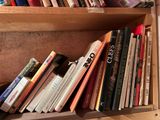 many books that are on the shelves in the room