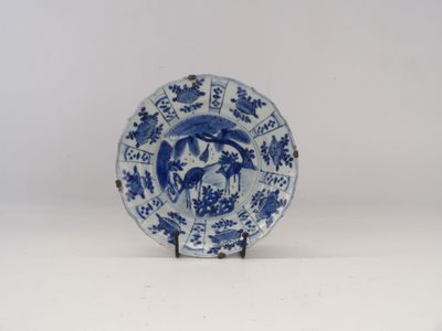 a blue and white plate with a bird on it