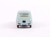 a small toy car that is sitting on a white surface