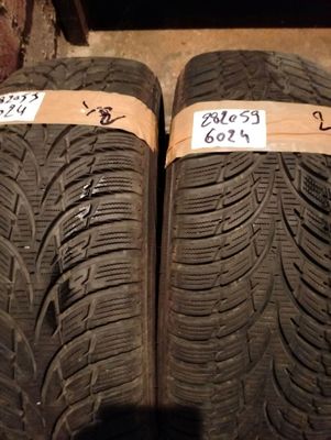 tire treads on the ground with price tags on them