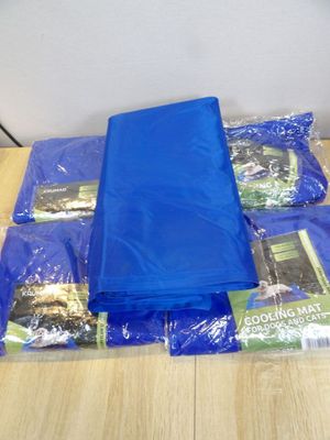 a pile of blue plastic bags sitting on a table