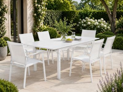 a white table and chairs on the patio