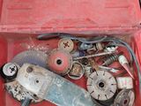 a red tool box filled with tools on a table
